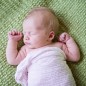 newborn baby photographed on bright green blanket by little rock photographer