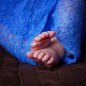 tiny toes wrapped in blue during newborn photography session in arkansas by little rock photographer