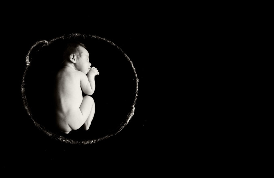 Newborn picture in basket in black and white