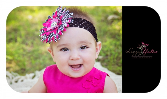 Sweet Baby Girl with a pink flower headband Smiles in a Little Rock Park