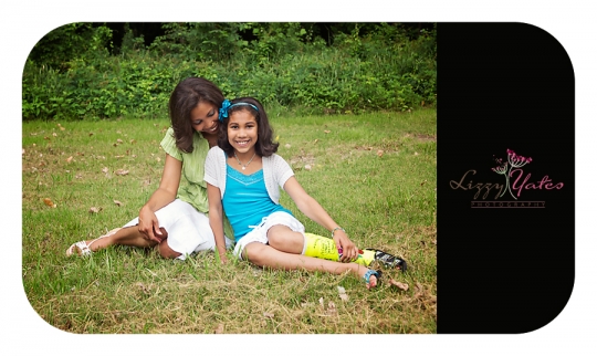 A mother looks lovingly at her daughter for a family photograph near downtown Little Rock