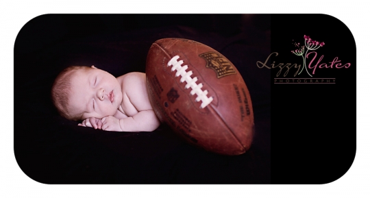 A baby boy and his football during a photo session in West Little Rock Arkansas