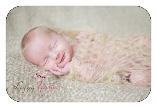 A sweet smile from a newborn baby girl from West Little Rock Arkansas