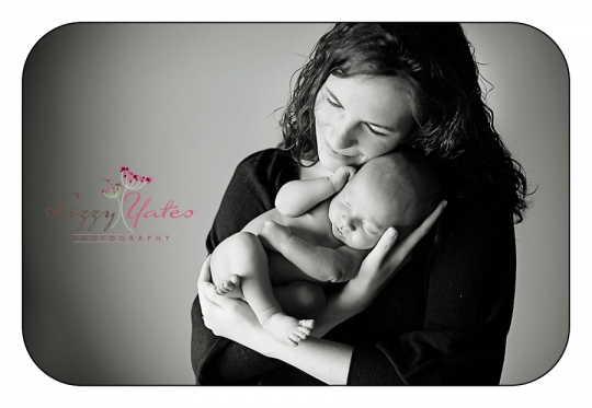 A newborn baby boy and his mom during pictures in little rock