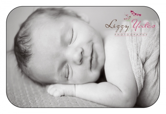 baby smiles during little rock newborn pictures