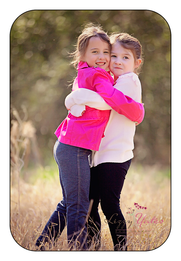 sisterly love during family picturs in little rock arkansas